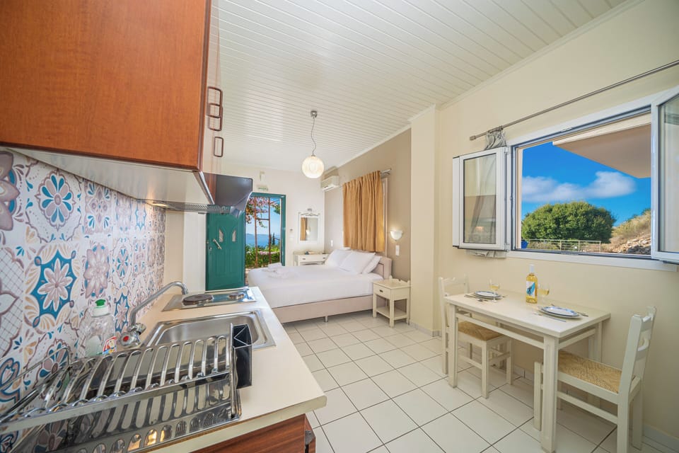 Studio, Sea View, Ground Floor | Down comforters, in-room safe, soundproofing, iron/ironing board