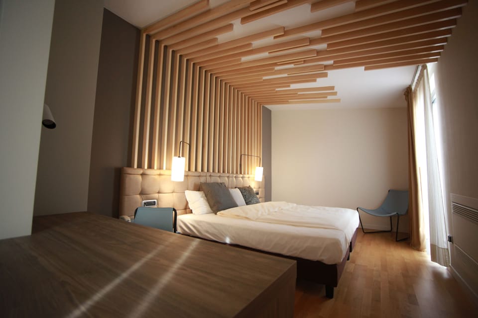 Family Triple Room | Premium bedding, minibar, in-room safe, individually decorated