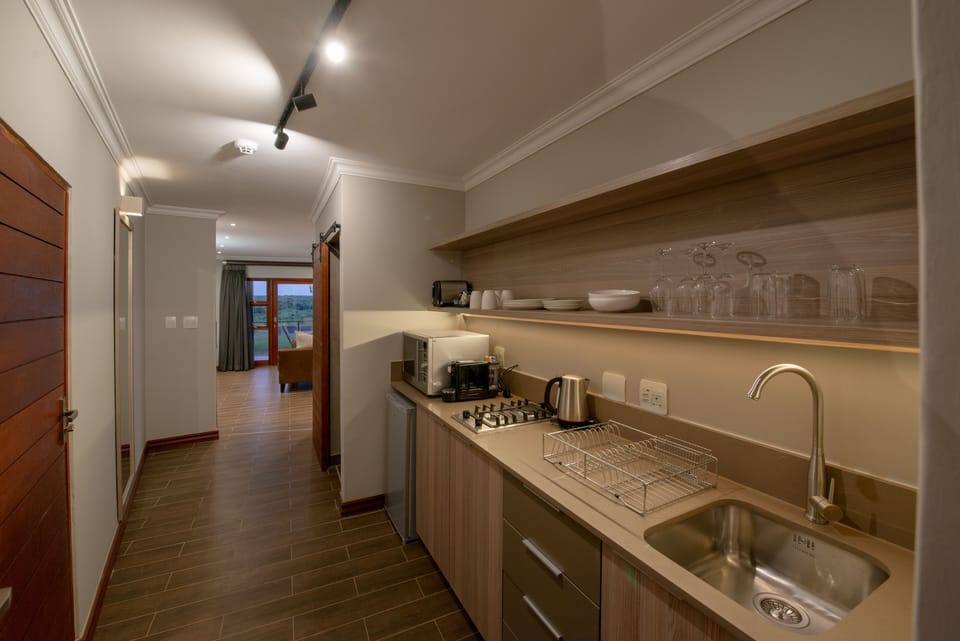 Deluxe Room | Private kitchen | Espresso maker, coffee/tea maker, fridge, microwave