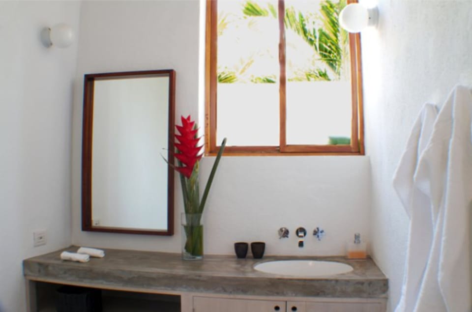Separate tub and shower, rainfall showerhead, designer toiletries