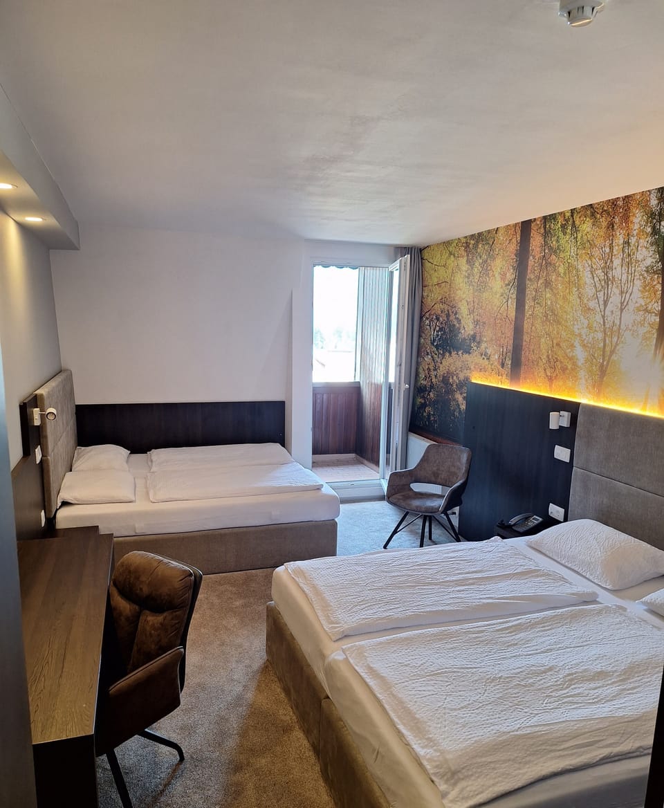 Quadruple Room | 1 bedroom, in-room safe, desk, blackout drapes