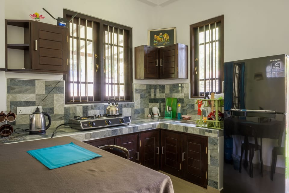 Superior Studio, 1 King Bed, Garden View | Private kitchen | Refrigerator (on request), shared microwave