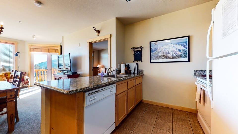 Condo, 2 Bedrooms | Private kitchen | Fridge, microwave, oven, dishwasher