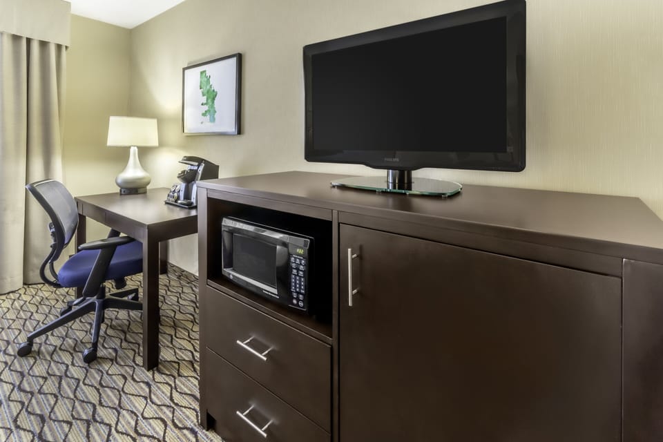 Desk, laptop workspace, blackout drapes, iron/ironing board