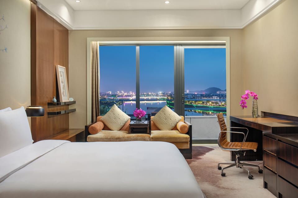 Premium Room, 1 King Bed, River View | In-room safe, desk, laptop workspace, blackout drapes
