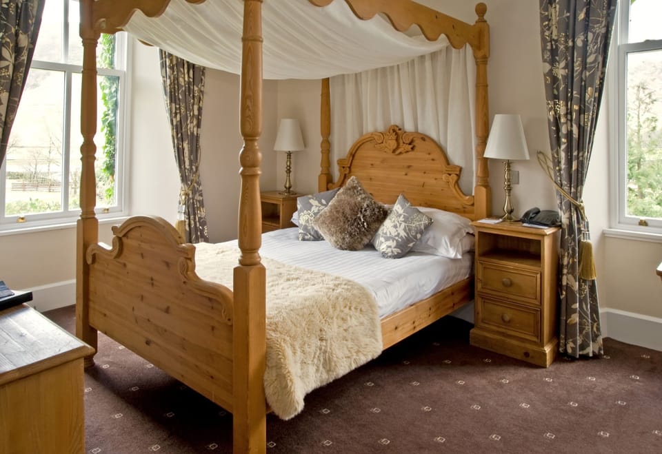 Room Four Poster | Premium bedding, desk, blackout drapes, iron/ironing board (on request)