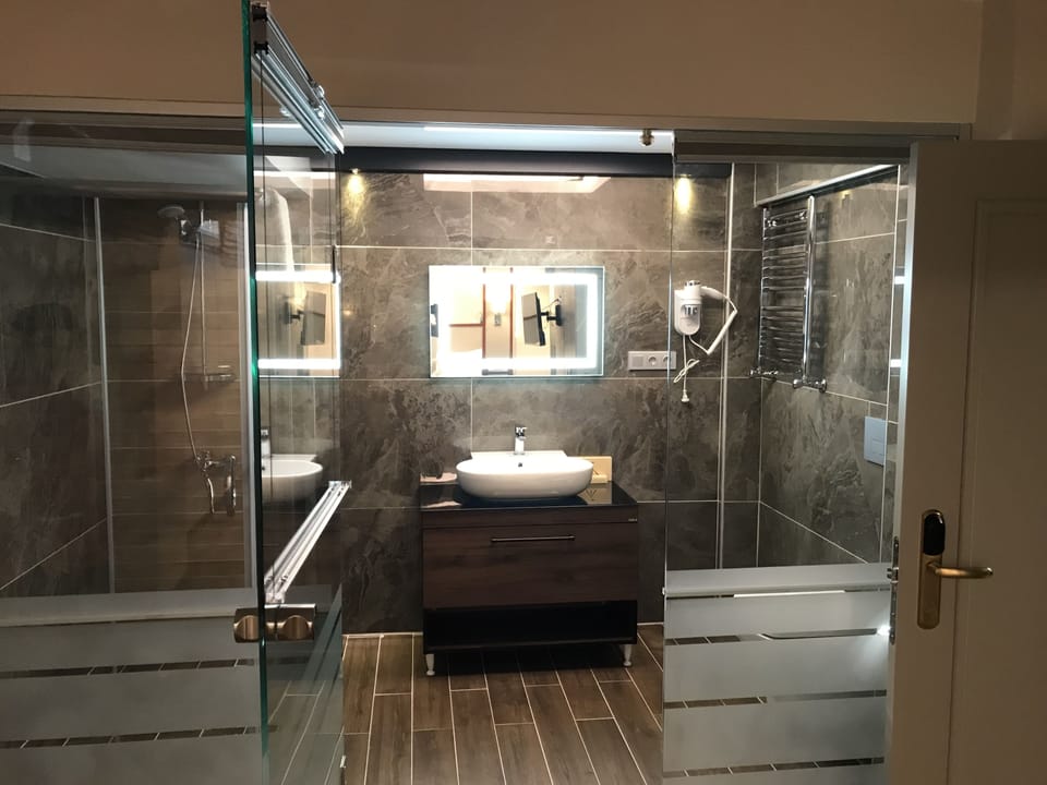Economy Room, 1 Queen Bed with Sofa bed (Basement Room) | Bathroom | Shower, rainfall showerhead, designer toiletries, hair dryer
