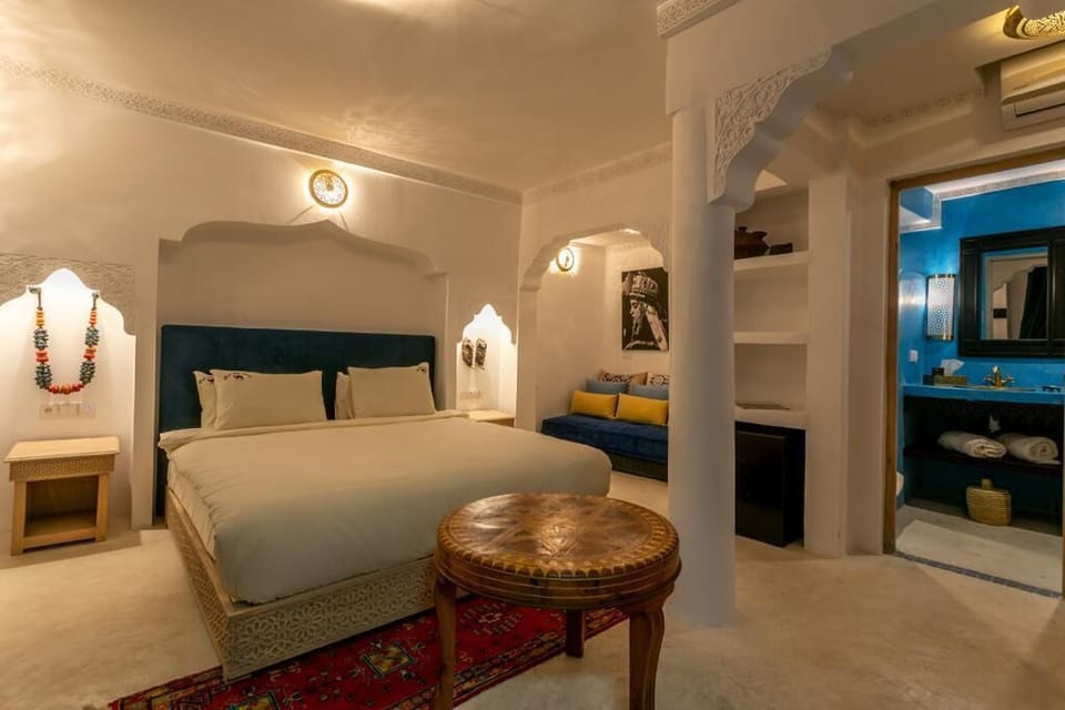 Junior Triple Room | Minibar, in-room safe, individually decorated, individually furnished
