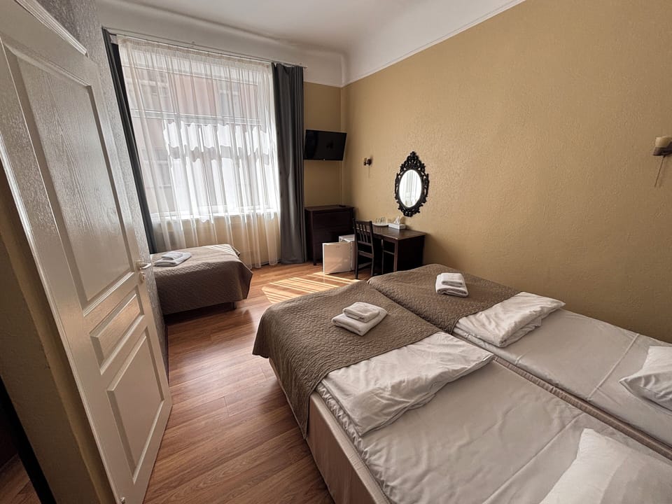 Triple Room, 3 Twin Beds | Bathroom | Shower, free toiletries, hair dryer, slippers
