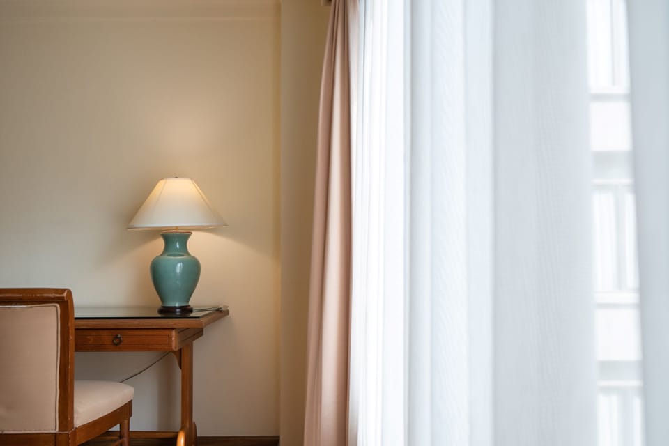 Premium Deluxe Double Room | Living area | 21-inch LED TV with cable channels, TV, DVD player