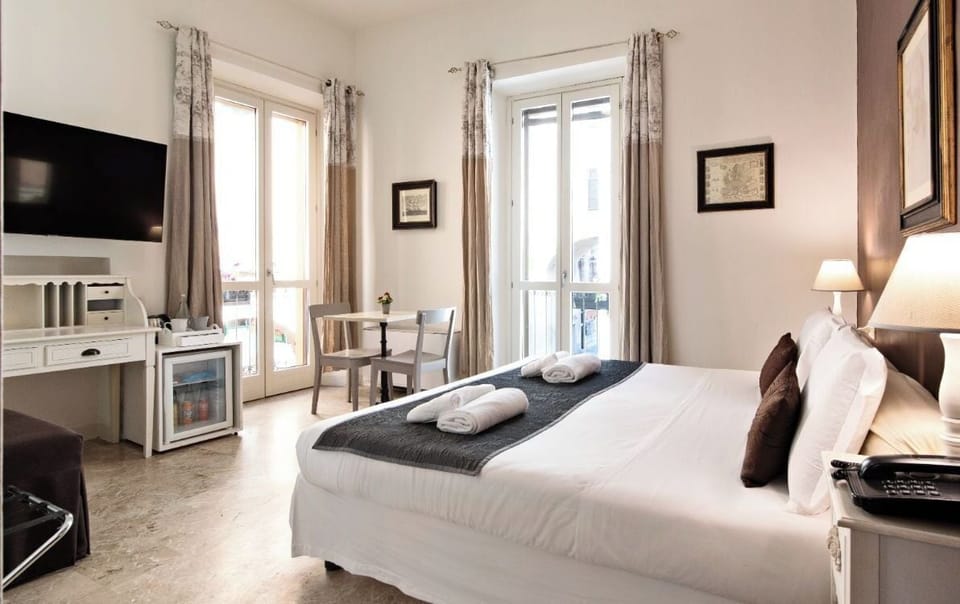 Junior Suite, City View | Down comforters, in-room safe, desk, blackout drapes