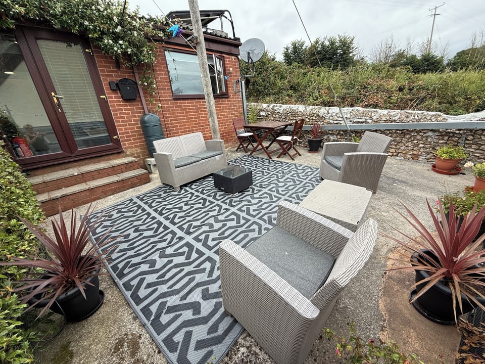 Private courtyard garden with outside furniture and Bistro dining table & chairs