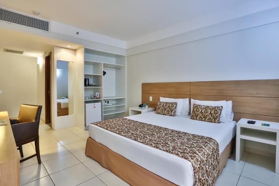 Superior Double Room | Minibar, in-room safe, laptop workspace, blackout drapes
