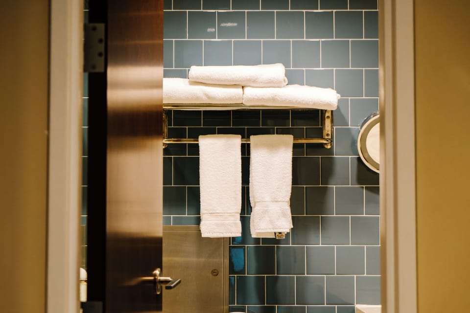 Combined shower/tub, hair dryer, towels, soap