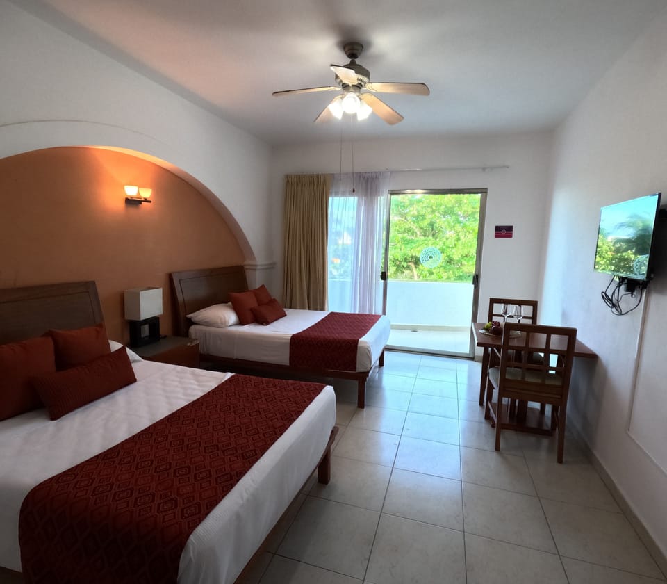 Standard Room, 1 Bedroom, Partial Ocean View | Minibar, in-room safe, individually furnished, blackout drapes