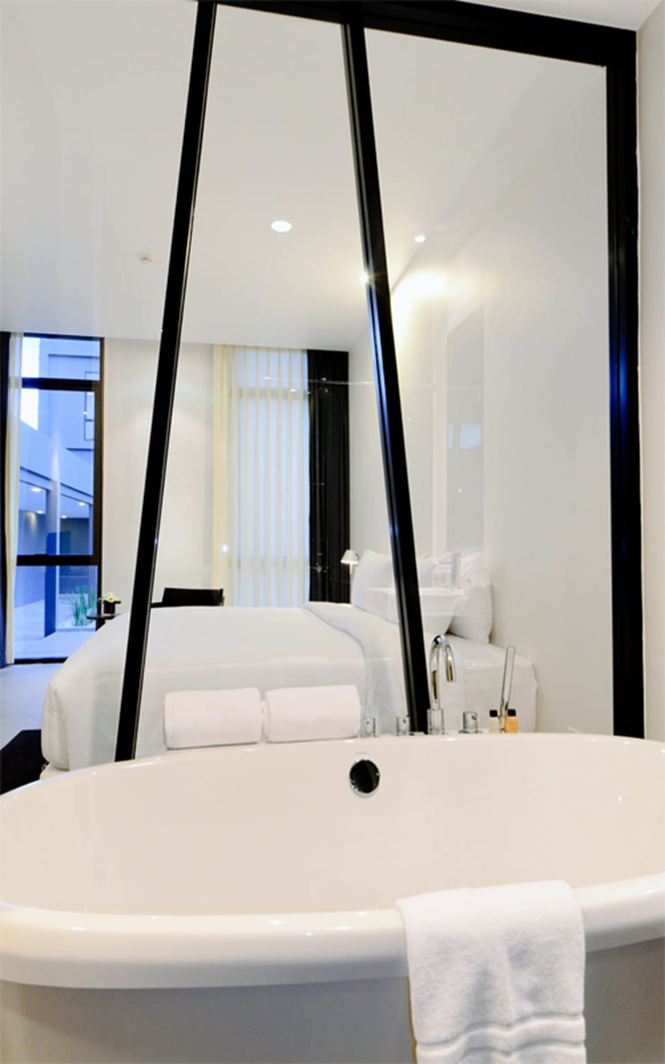 Separate tub and shower, rainfall showerhead, free toiletries