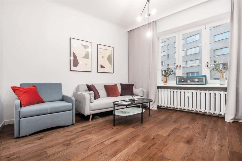 Living room with a comfortable sofa and TV. 