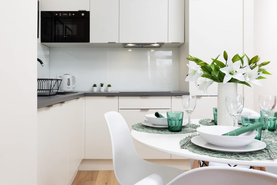 The sleek design of the kitchenette blending seamlessly with the living area.