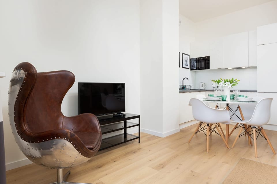 Enjoy your favorite shows on the flat-screen television in the elegant living area.