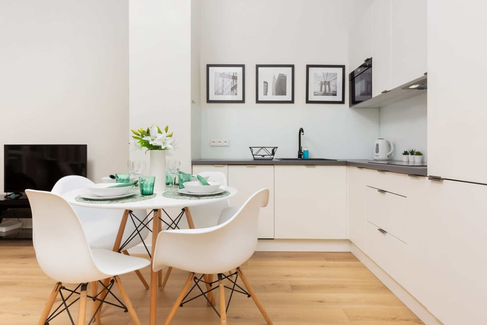 A large dining table with chairs is perfect for family meals.