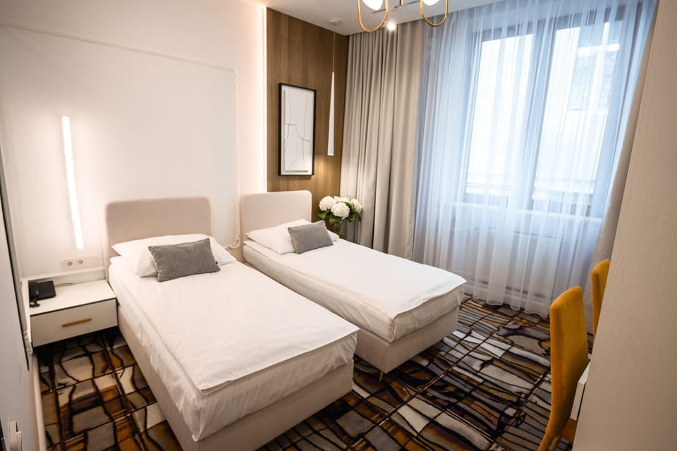 Standard Twin Room | Desk, iron/ironing board, free WiFi, bed sheets
