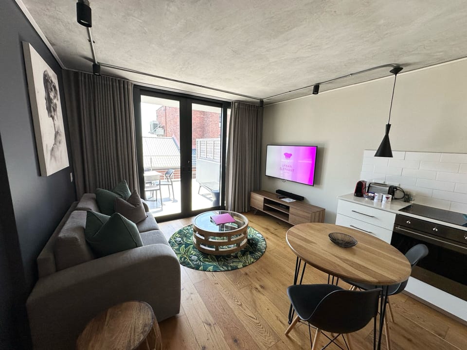 Apartment 317 | Living area | 50-inch Smart TV with digital channels, TV, Netflix