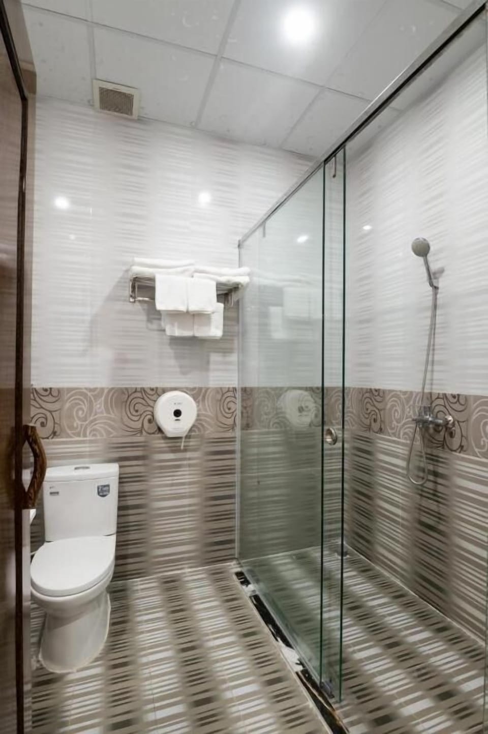 Shower, free toiletries, hair dryer, slippers