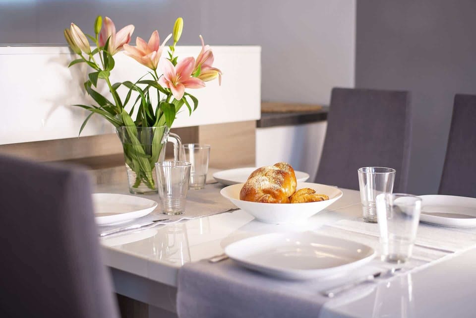 Close-up of the dining table with tableware. 