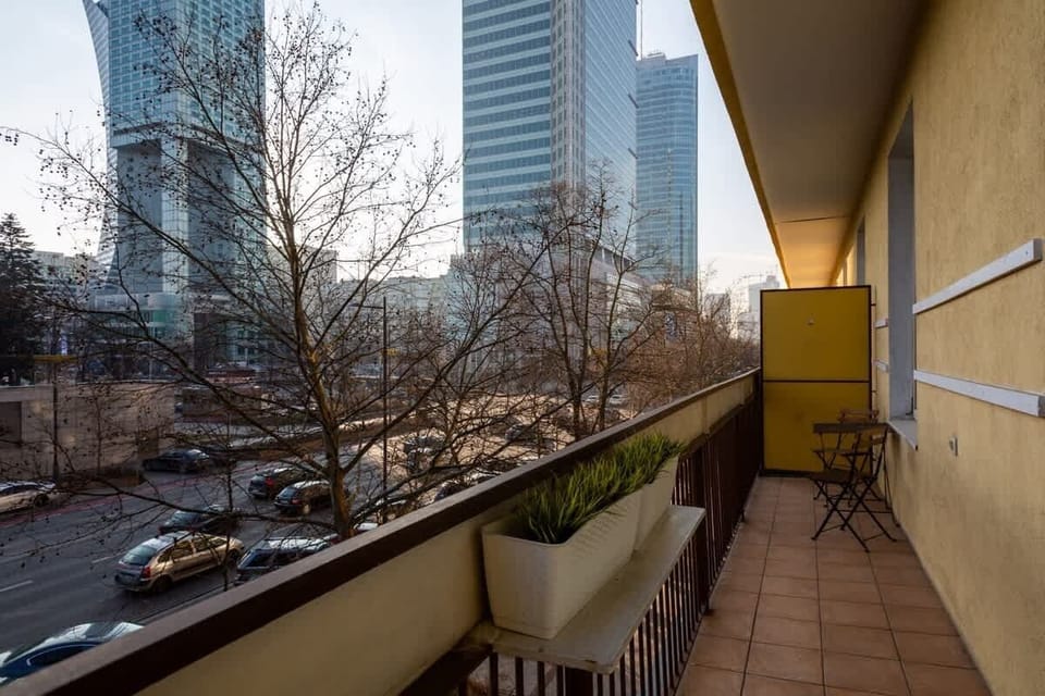 The balcony provides a perfect spot for enjoying the fresh air. 