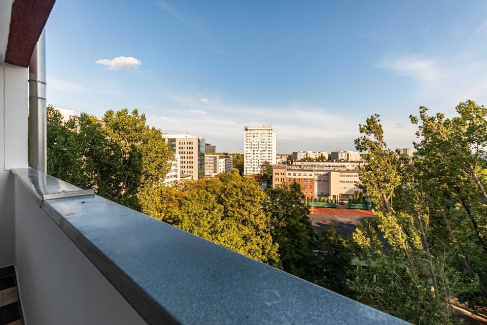 Balcony offering view of the city and surrounding area.