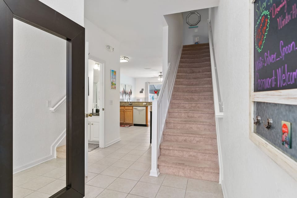 Stairs that lead to the master and twin bedrooms.