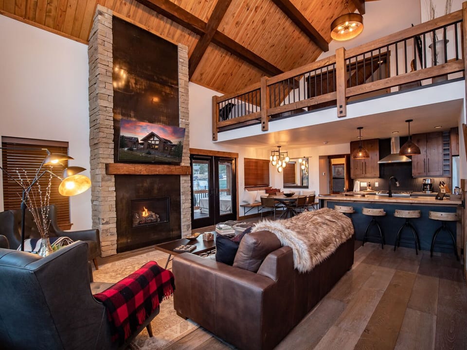 Living area with 25 foot tall fireplace and 50 inch smart TV