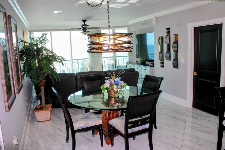 Bright dining area with panoramic window views and modern decor