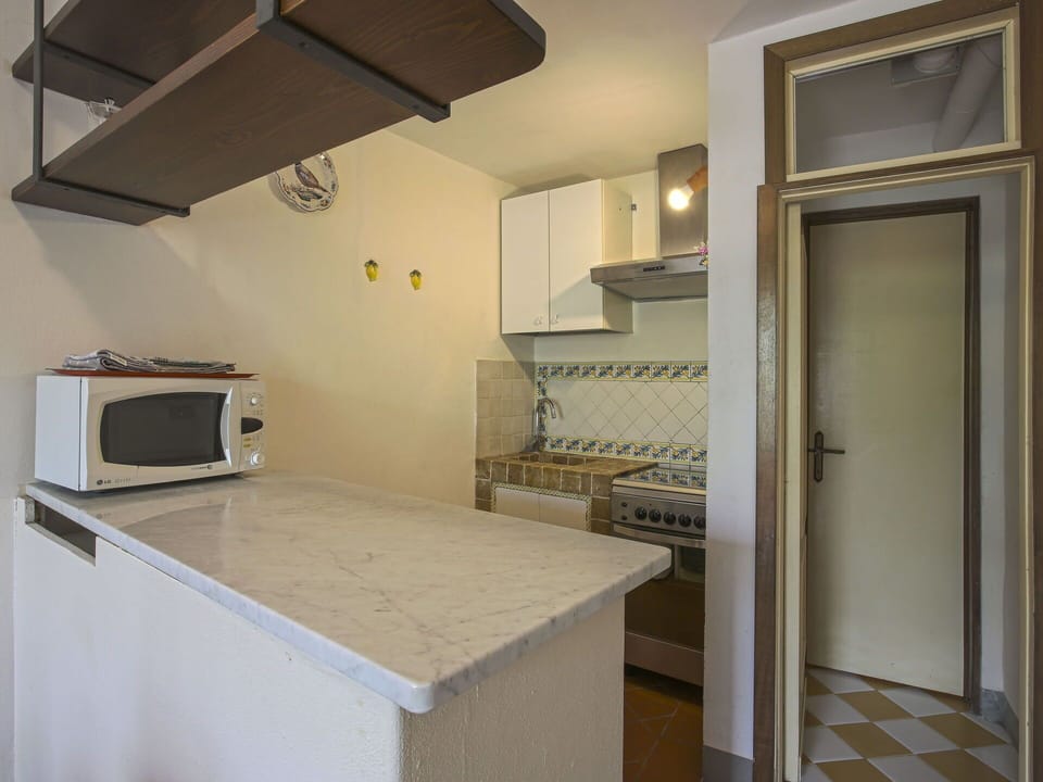 Countertop, Cabinetry, Kitchen Appliance, Kitchen Stove, Home Appliance, Gas Stove, Kitchen, Exhaust Hood, Wood, Lighting