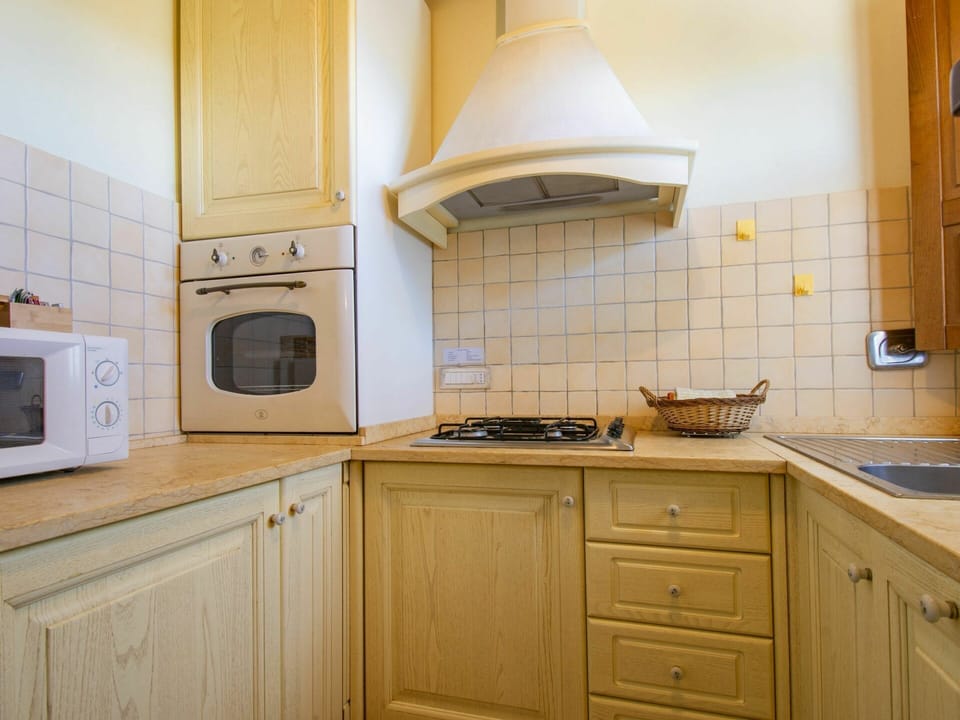 Cabinetry, Property, Countertop, Furniture, Kitchen Appliance, White, Kitchen Stove, Home Appliance, Wood, Building