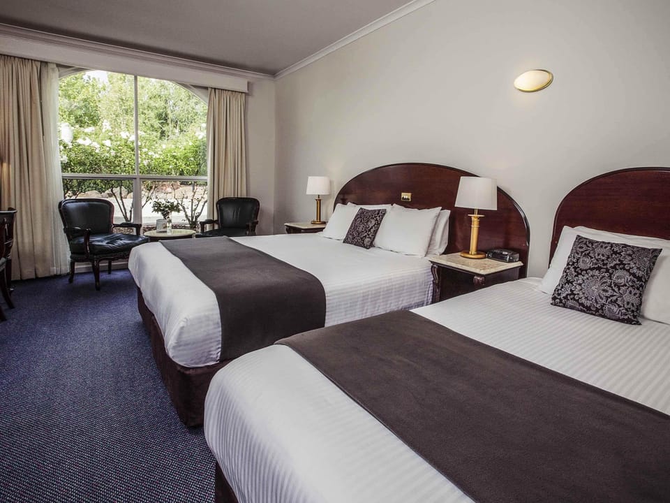 Room, Multiple Beds (Courtyard) | Minibar, in-room safe, desk, iron/ironing board