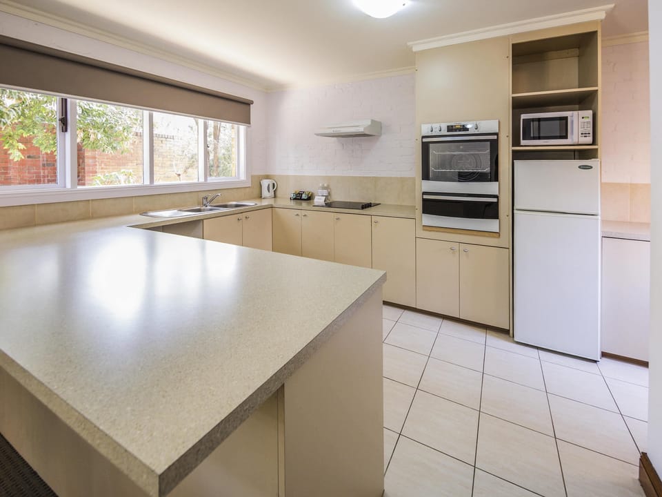 Apartment, 2 Bedrooms | Minibar, in-room safe, desk, iron/ironing board