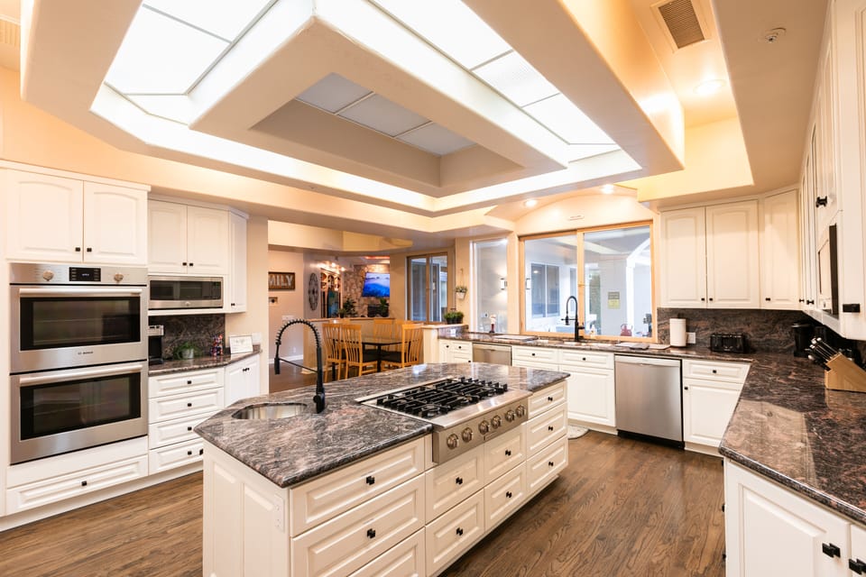 Kitchen: 2 ovens, 2 dishwashers, 2 sinks, side-by side fridge, fully stocked