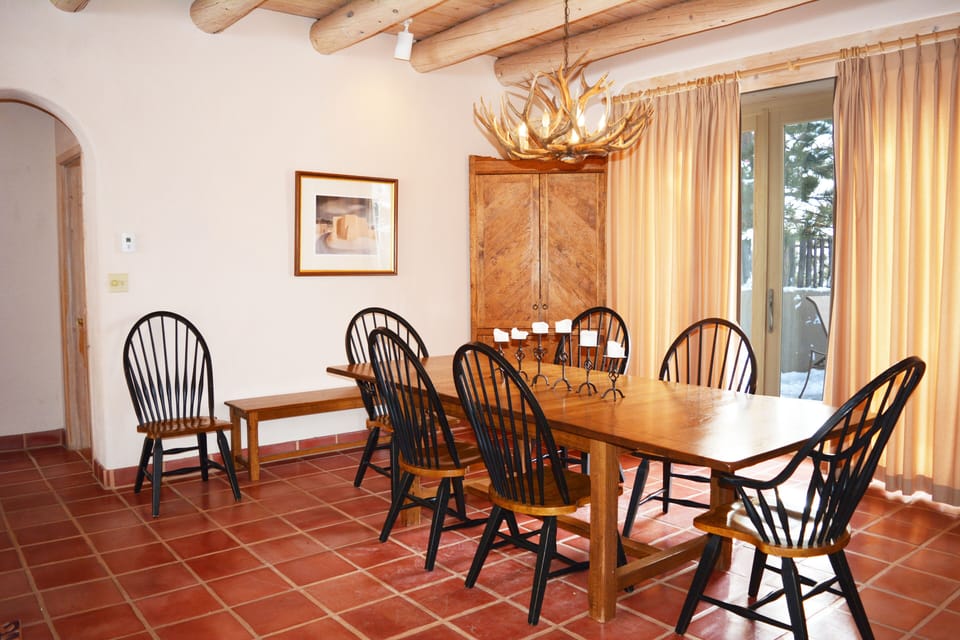 Walk out to patio for outdoor dining and hot tub (arch goes to guest bedrooms)