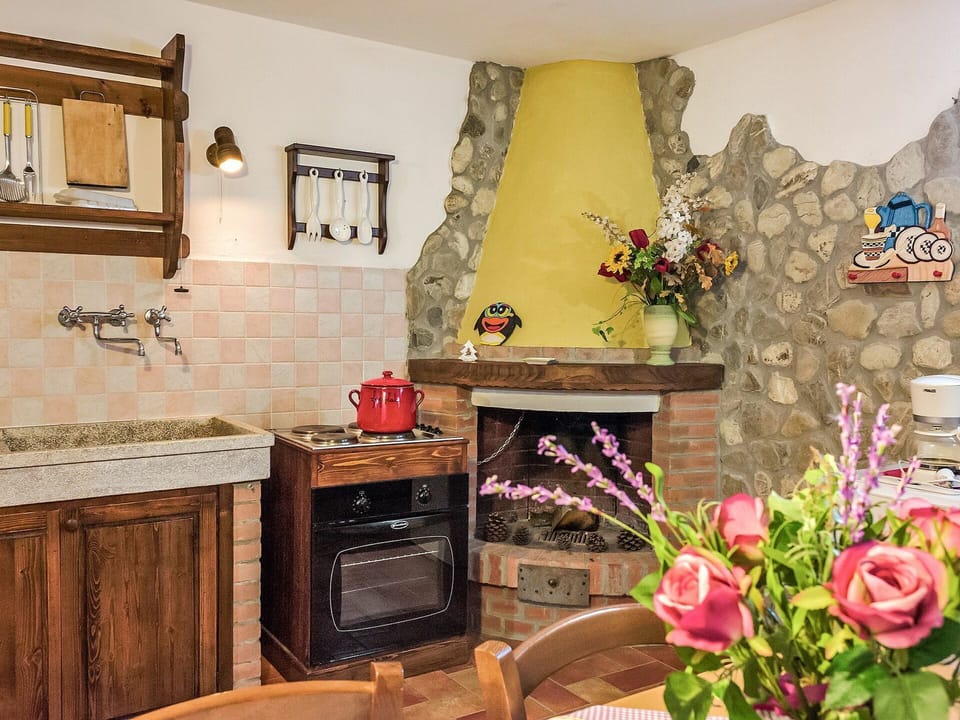 Room, Property, Interior Design, Fireplace, Furniture, Kitchen, Yellow, Home, Hearth, Countertop