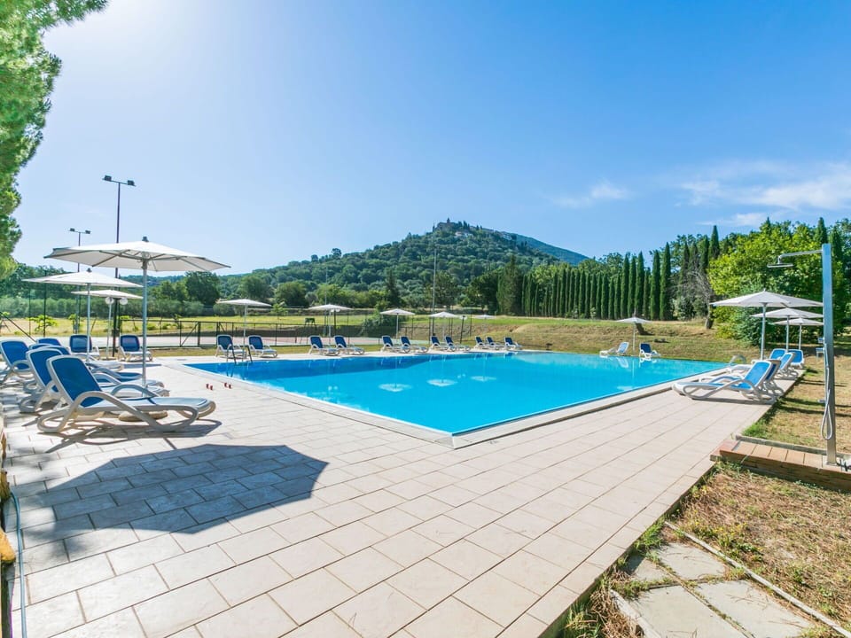Sky, Water, Swimming Pool, Building, Chair, Tree, Outdoor Furniture, Plant, Shade, Sunlounger