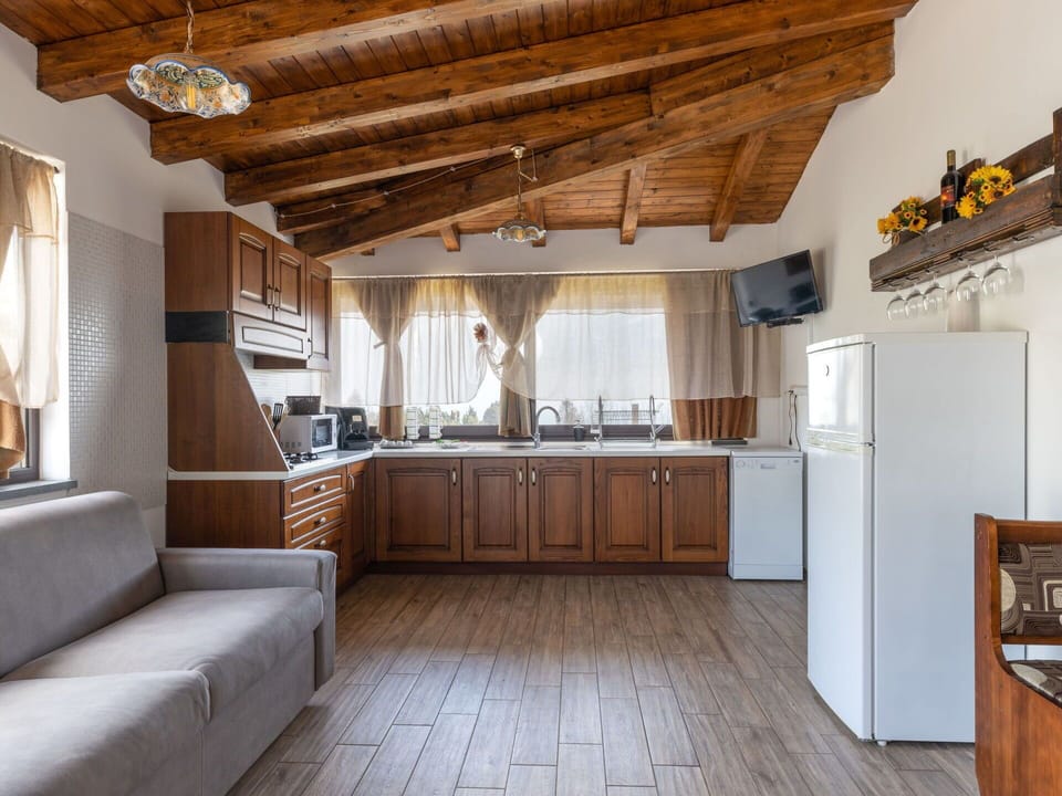 Cabinetry, Property, Furniture, Countertop, Wood, Couch, Interior Design, Floor, Curtain, Kitchen