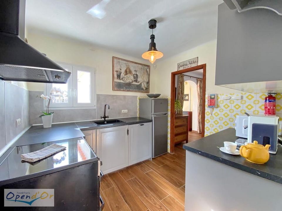 Casa Sol Kitchen access from the hall and from the exterior back dining area.