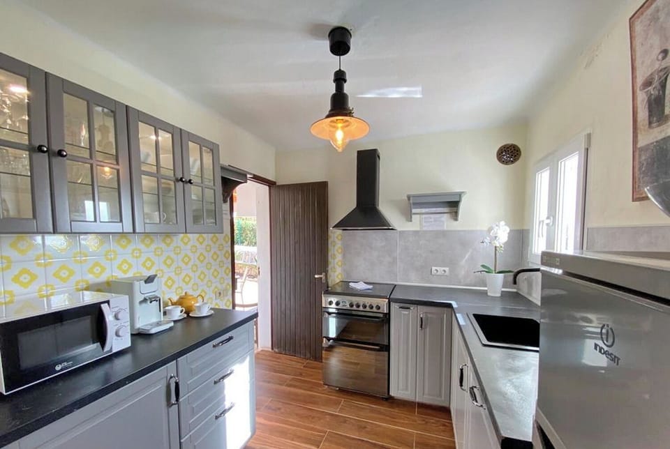 Casa Sol Kitchen access from the hall and from the exterior back dining area.