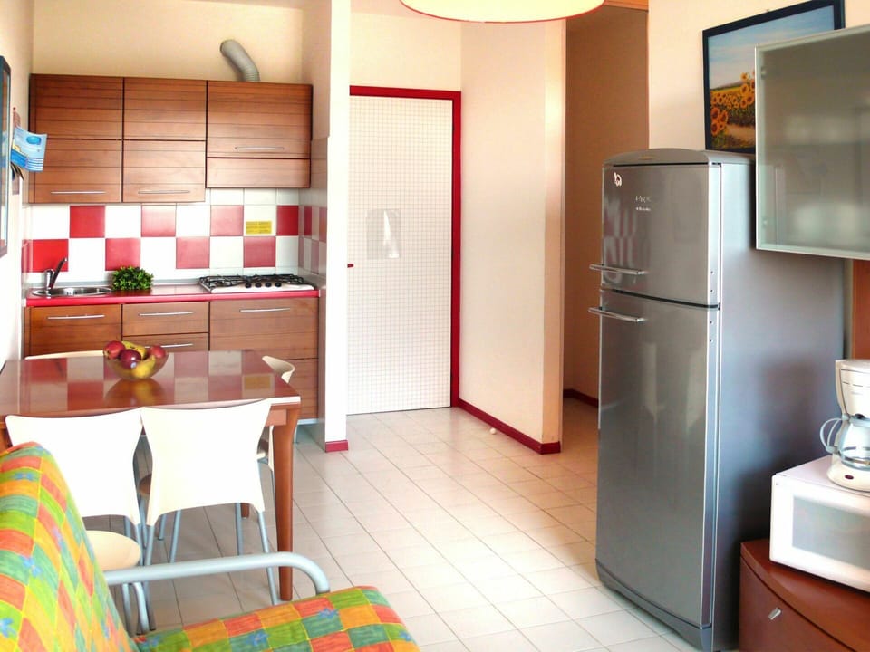 Room, Property, Floor, Interior Design, Furniture, Building, Major Appliance, Orange, Kitchen, Cabinetry
