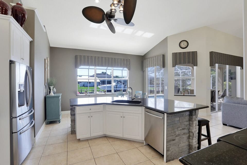 Kitchen Has stainless steel appliances and dishwasher in center island