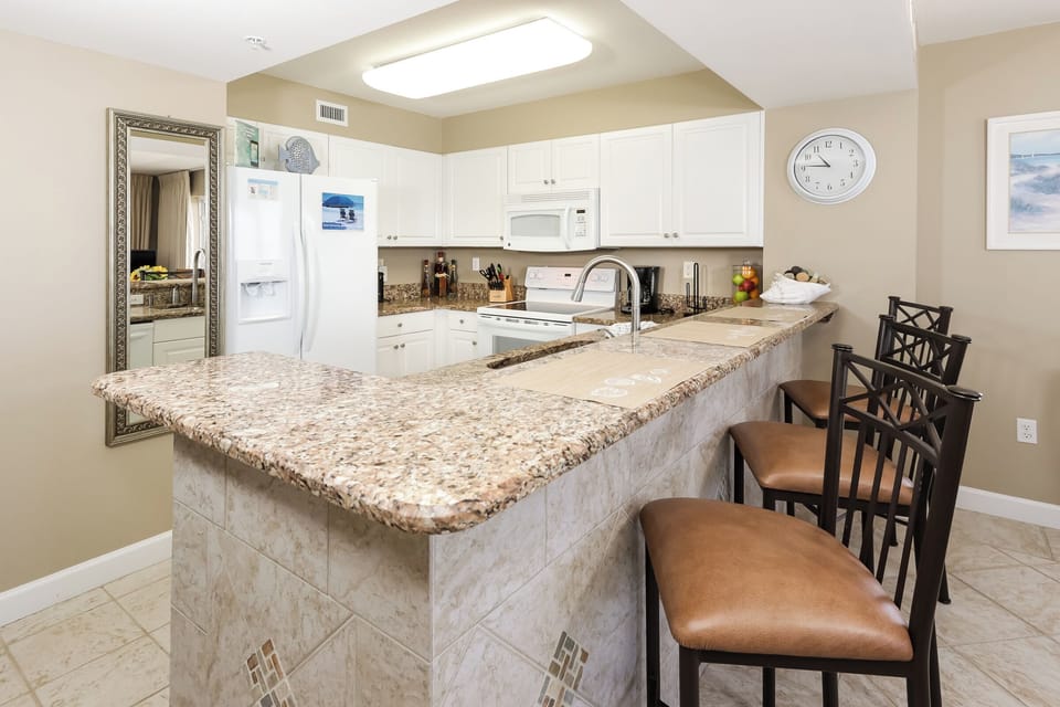 Condo (Pelican Isle 401 - Sun, Surf, and San) | Private kitchen | Cookware/dishes/utensils