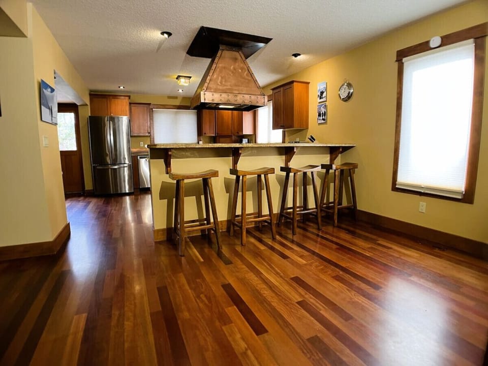 Kitchen area looking from Living area. Solid Cherry Maple Hardwood Floors throughout.