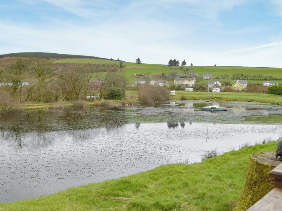 Relaxing views over the lake | Herons Log Cabin, Rosebush