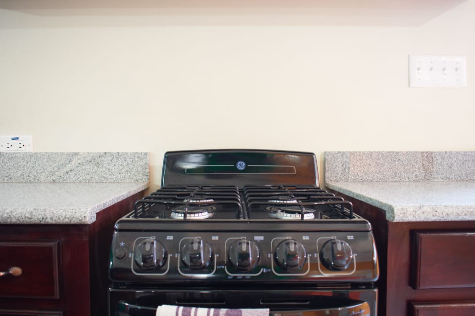 Exclusive Studio Suite, 1 Bedroom, Garden View, Ground Floor | Private kitchen | Full-size fridge, microwave, oven, stovetop